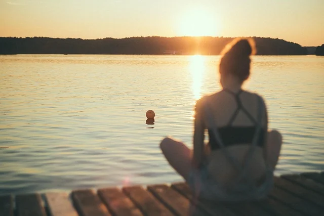 Sitting quietly at the end of a dock as evening settles